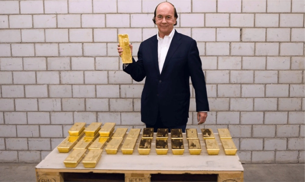 Jim Rickards holding gold bar